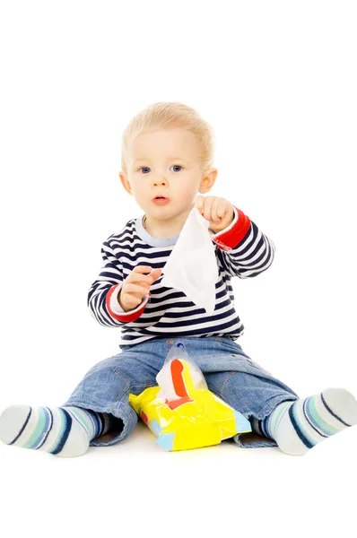 The little boy gets the wet wipes, and is played Stock Picture