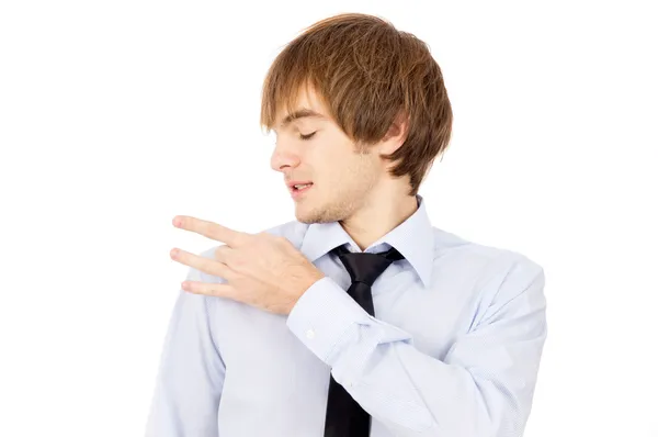A handsome guy removes dandruff, dressed in a shirt and tie — Stock Photo, Image