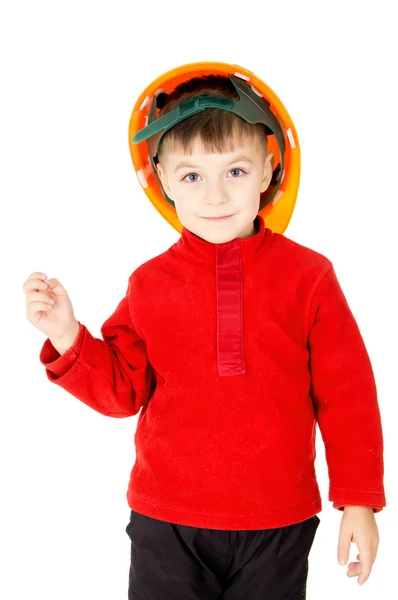 Un niño pequeño de pie con un casco — Foto de Stock