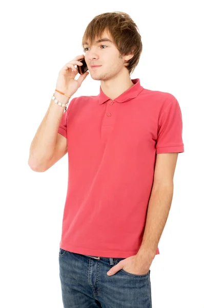 Cheerful guy is standing and talking on a mobile phone — Stock Photo, Image