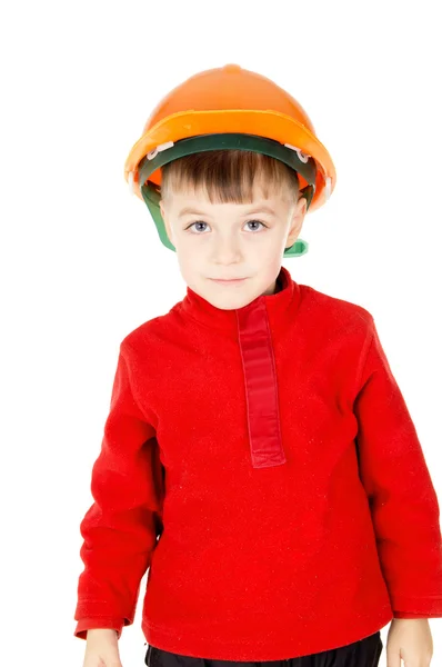 Menino feliz de pé com um capacete — Fotografia de Stock