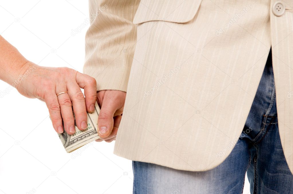 man in the suit gently takes a bribe