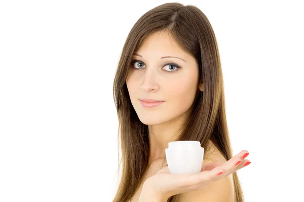 Girl holds cream — Stock Photo, Image