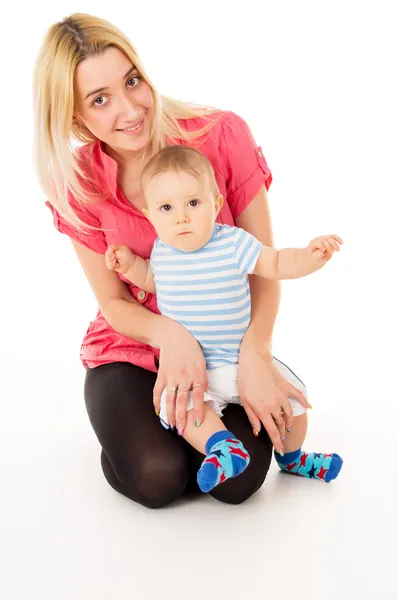 Beautiful mom hugs baby — Stock Photo, Image