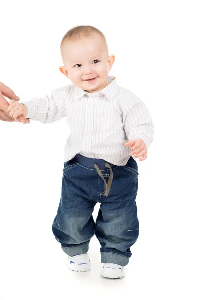 Cheerful boy in clothes makes first steps — Stock Photo, Image