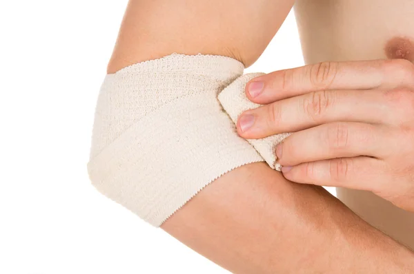 Bandaging the elbow with an elastic bandage — Stock Photo, Image