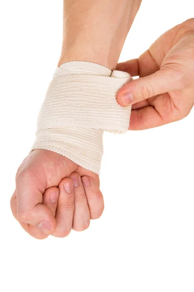 De hand verbanden met een elastisch verband — Stockfoto