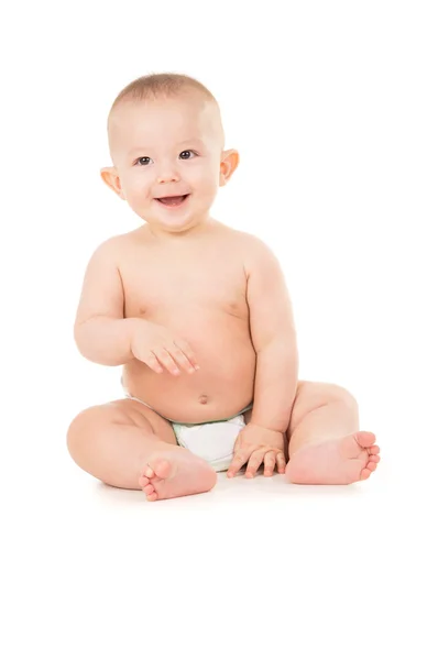 Beautiful little baby sits on the floor — Stock Photo, Image