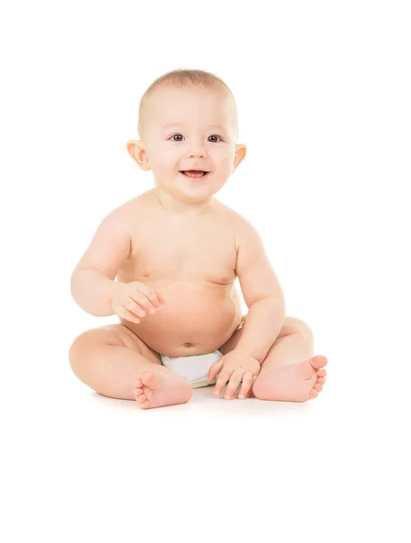 Beautiful little baby sits on the floor — Stock Photo, Image