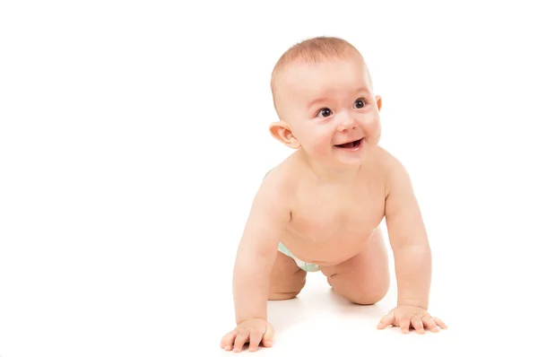 Pequeno bebê feliz rastejando no chão — Fotografia de Stock