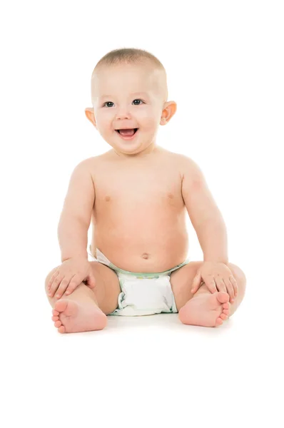 Bebê pequeno feliz senta-se no chão — Fotografia de Stock