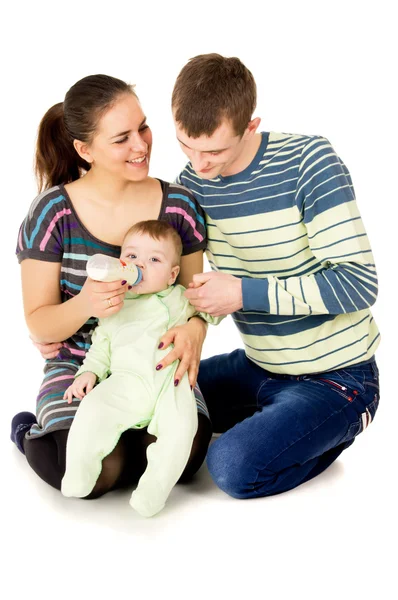 Happy the parents feeds baby — Stock Photo, Image