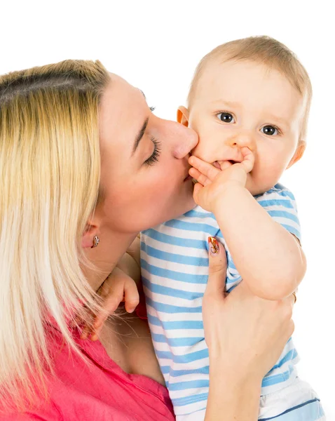 Mother kisses her baby Royalty Free Stock Images
