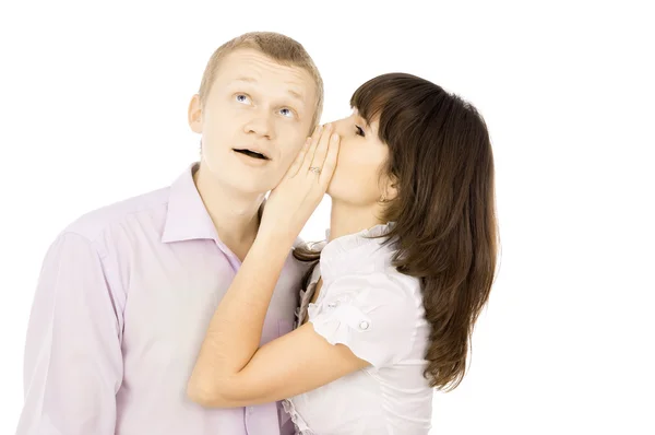 The girl whispers to the guy in the ear — Stockfoto