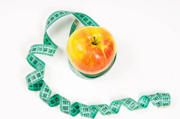 Tasty apple and measuring tape — Stock Photo, Image