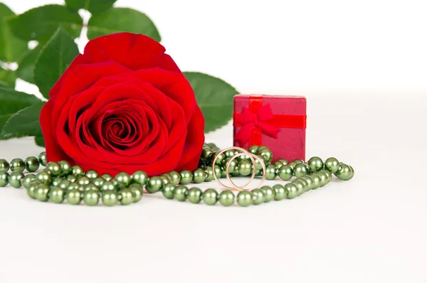 Flower rose with rings and beads — Stock Photo, Image