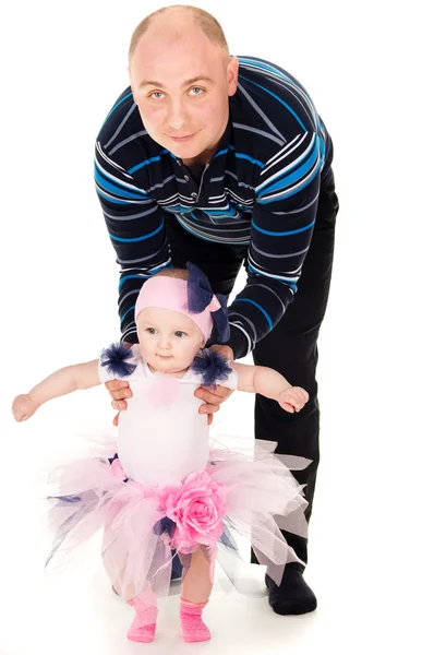 Dad and mom kissing baby — Stock Photo, Image