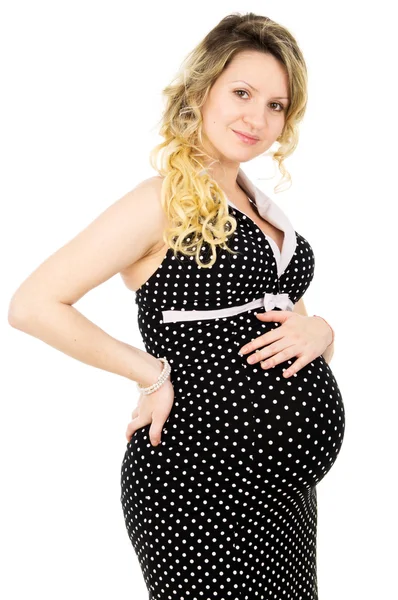 Schöne schwangere Mädchen in einem Kleid isoliert — Stockfoto