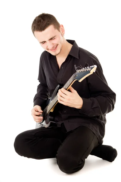 Mischievous guy plays the electric guitar — Stock Photo, Image