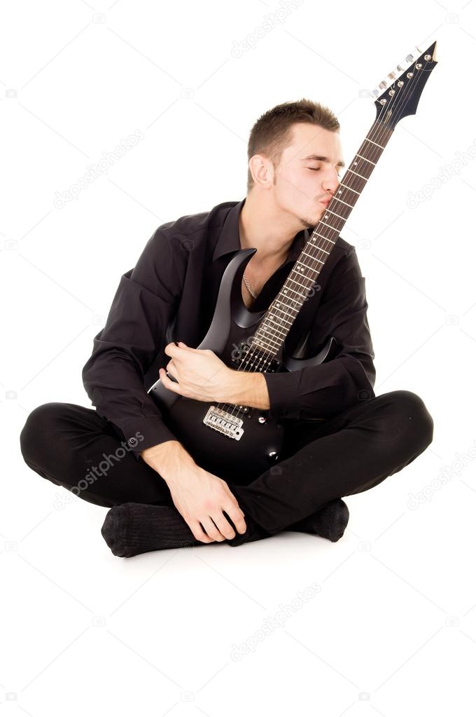guy kisses the electric guitar