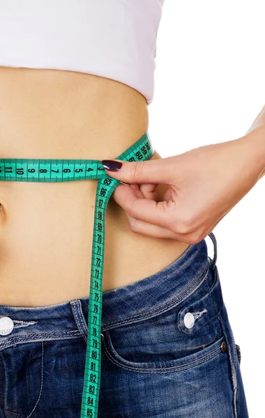 Slim girl measure its waist and shows OK — Stock Photo, Image