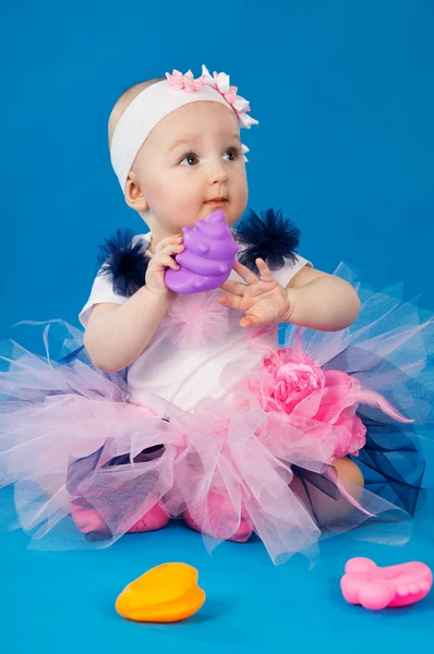 Baby and soap bubbles on a blue background — Stock Photo, Image