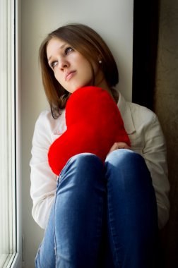 sad girl looking out the window waiting for her husband clipart