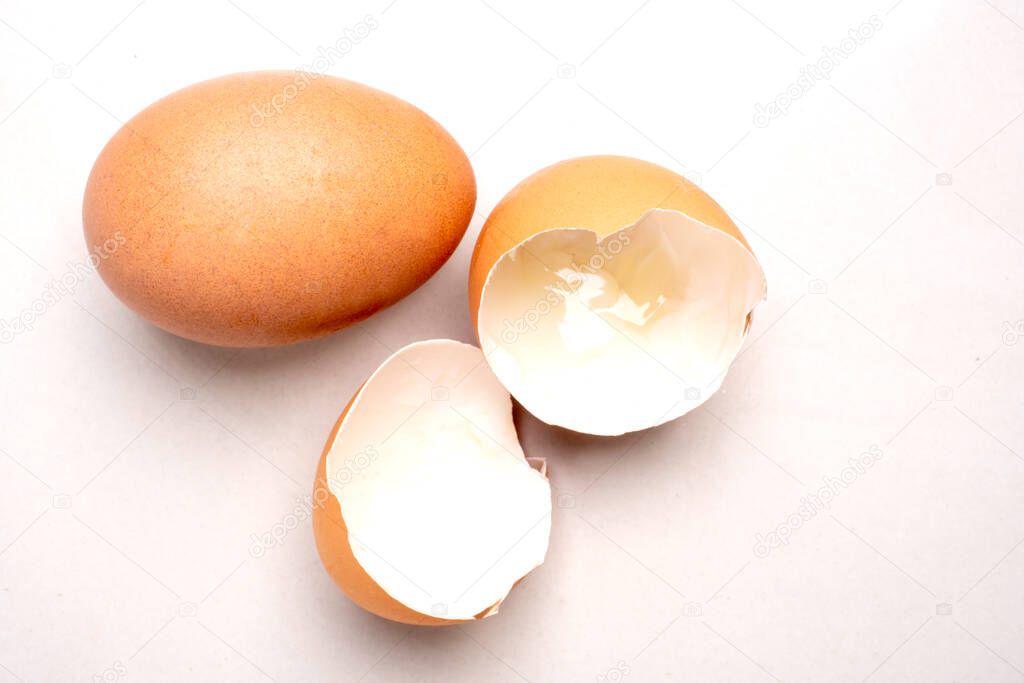 Chicken eggs and eggshells isolated from the white background.soft focus.
