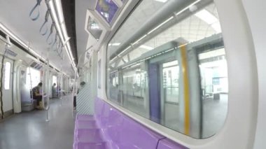 Bangkok, Thailand - 10 August 2022: MRT purple line between Tao-Poon to Khlong-Bang-Phai.Metropolitan Rapid Transit (MRT) purple line, view from inside the train