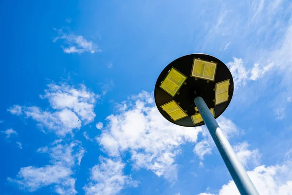 solar light blue sky background with white clouds on a clear day, Solar cell lamp, and Alternative energy from the sun.