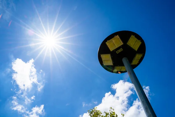 solar light blue sky background with white clouds on a clear day, Solar cell lamp, and Alternative energy from the sun.