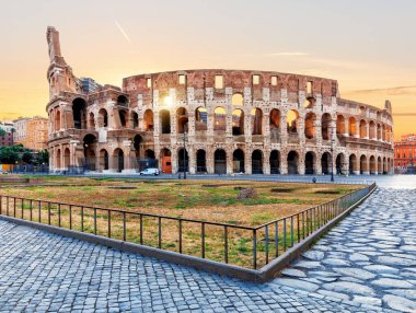 Roman Coliseum at sunrise, the full view without people, Italy.