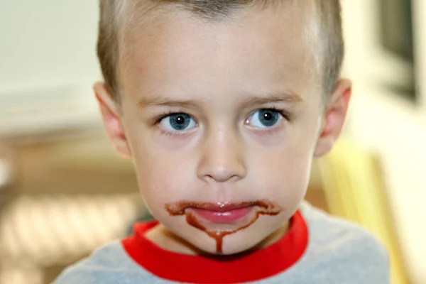 Toddler with chocolate mouth — Stock Photo, Image