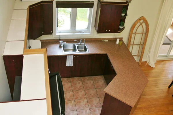 Modern wood kitchen with cabinets from the top — Stock Photo, Image