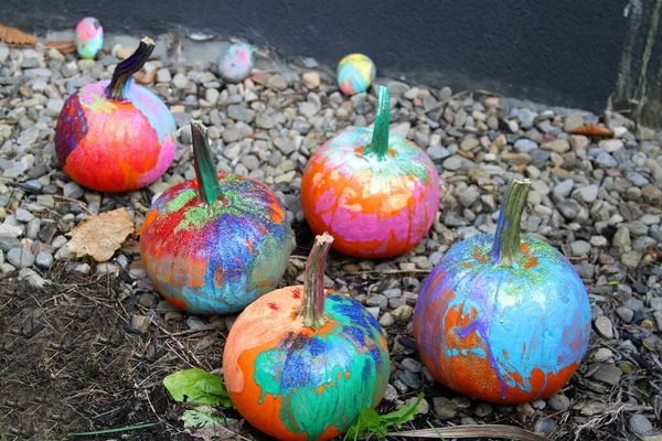 Coloful painted pumpkins with glitter for halloween
