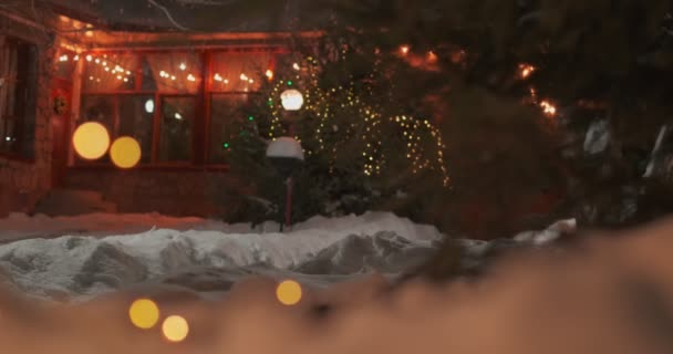 Two Kids Street Snowy Christmas Eve Decorated House Back Slow — Stock video