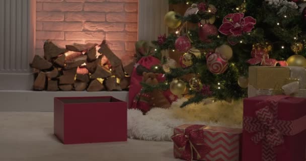 Cover Falls Dark Red Gift Box Laying Decorated Christmas Tree — Stockvideo