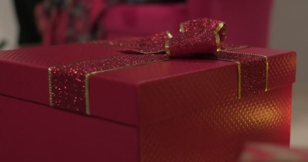 Red Colored Christmas Gift Box Moves Itself Slow Motion — Stock Video