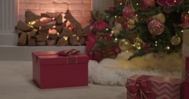 Red colored christmas gift box opens by itselfm slow motion