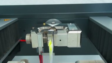 Polymer thread sample tape for plastic sack bags is tested for strength in laboratory