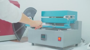 Polymer thread for plastic sack bags is installed to strength test machine, slow motion
