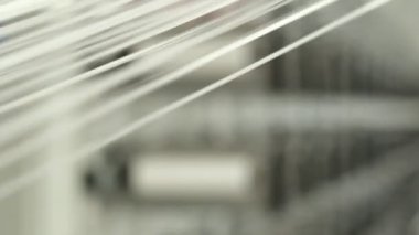 Polymer thread winding machine in action, slow motion