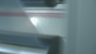 Watering the polymer tape in winding machine, slow motion