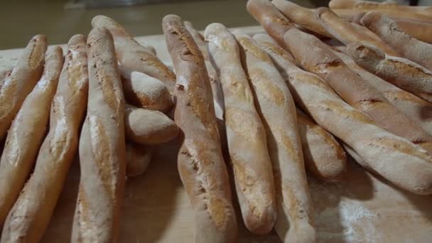 Fresh Baked Long Baguette Breads Lie Wooden Table Sprinkled Flour — Stock video