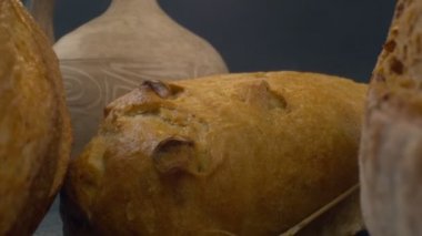 Close-up of fresh baked whole grain bread move in slow motion. Ready to eat