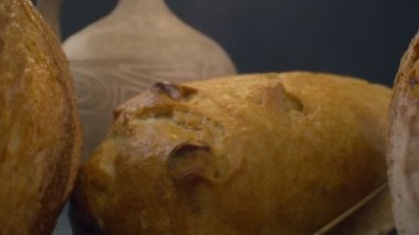 Close-up of fresh baked whole grain bread move in slow motion. Ready to eat