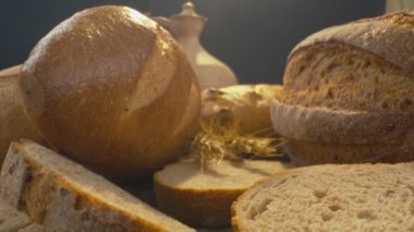 Close-up of fresh baked whole grain bread move in slow motion. Ready to eat
