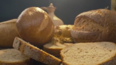 Close-up of fresh baked whole grain bread move in slow motion. Ready to eat