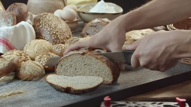Male Hands Cutting Fresh Baked Dutch Bread Wooden Table Full — Stock videók