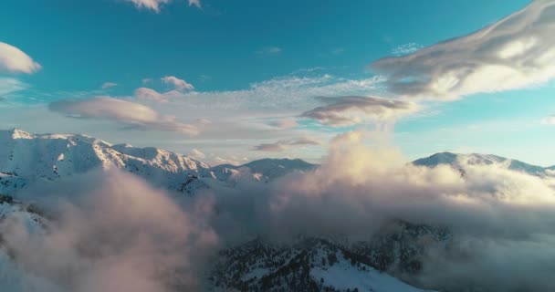 Drone Camera Filming Clouds Snowy Mountains Central Asia Sunset Slopes — Stockvideo